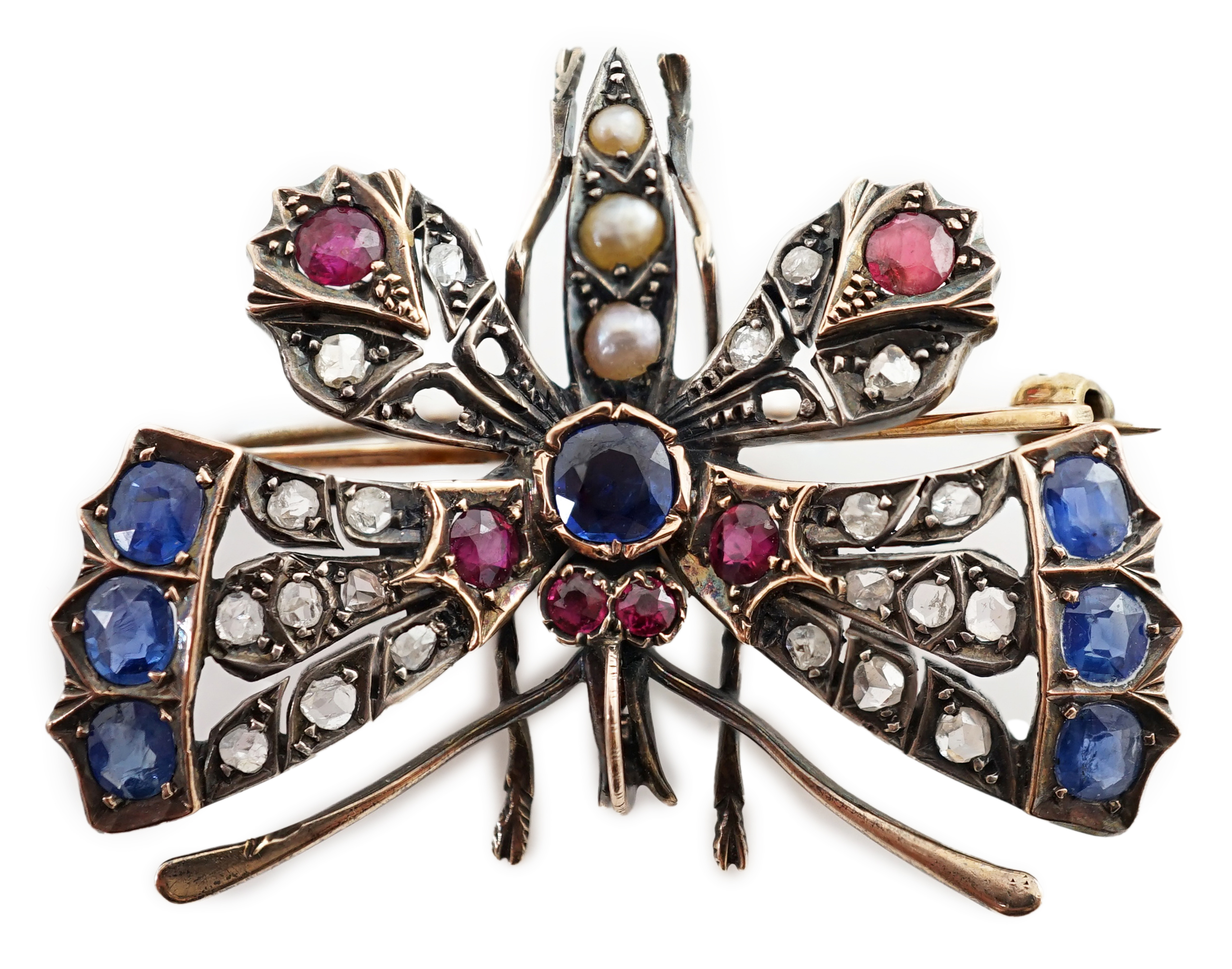 A Victorian gold, diamond, sapphire, ruby and split pearl cluster set butterfly brooch